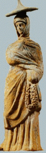 Esc. IV-III aC., Mujer con manto, Tanagra, Alelandra, Grecia
